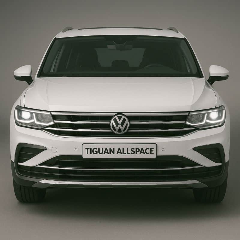 Frontansicht des VW Tiguan Allspace in Weiß mit breitem Kühlergrill, LED-Scheinwerfern und VW-Emblem.